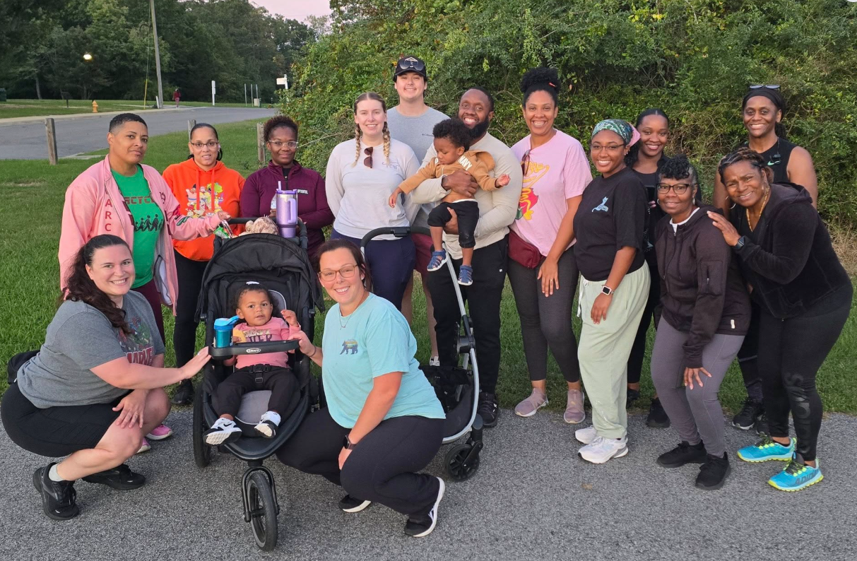 a group of people pose outside